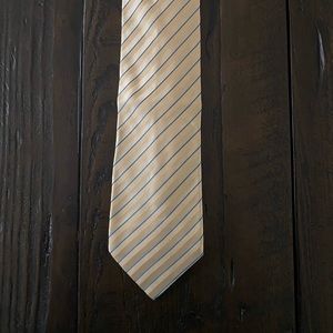 Brioni tie. Pale yellow with blue stripes. Made in Italy.